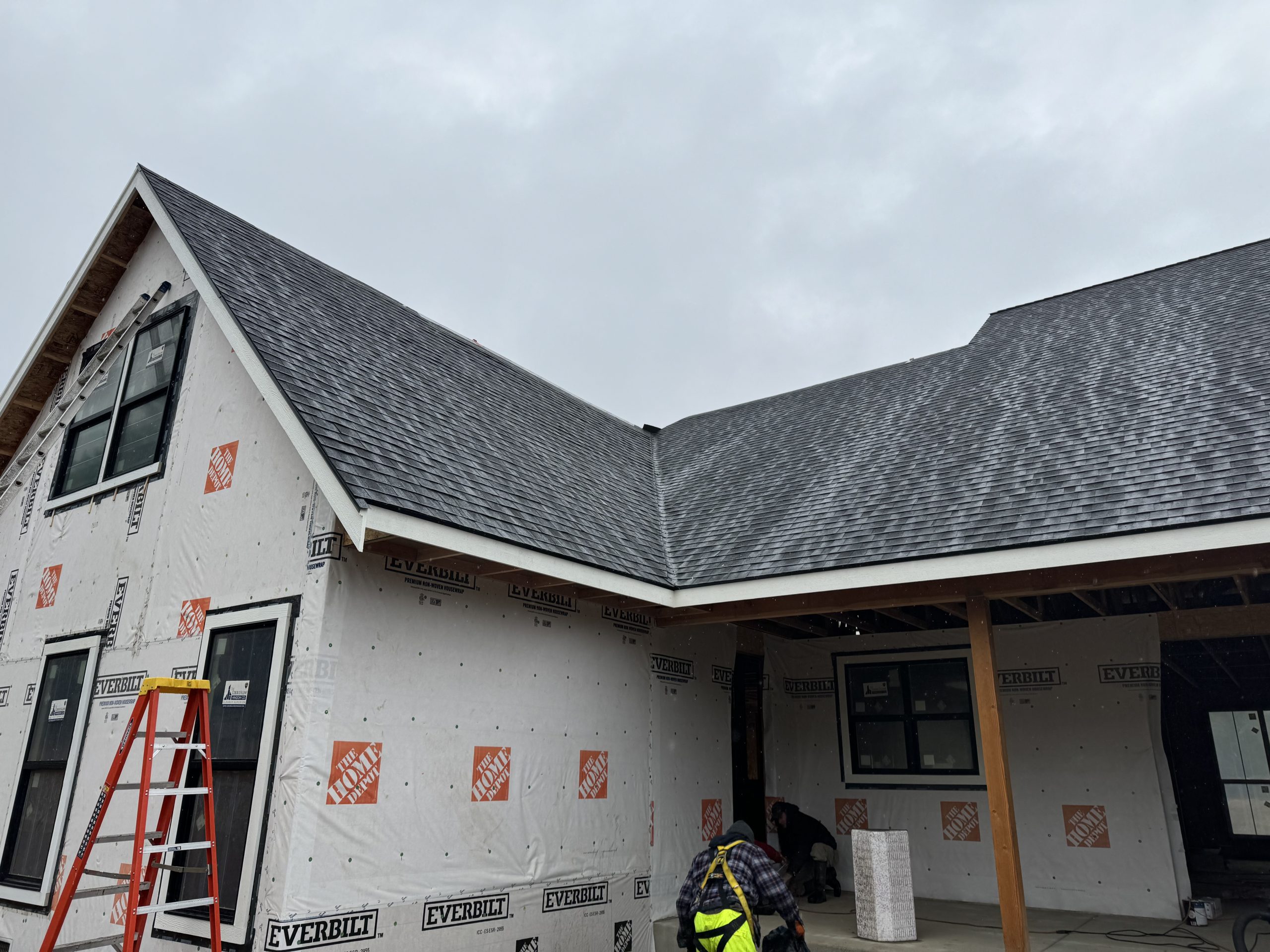 2 story house in new construction with windows and shingled roof, located in sandpoint idaho