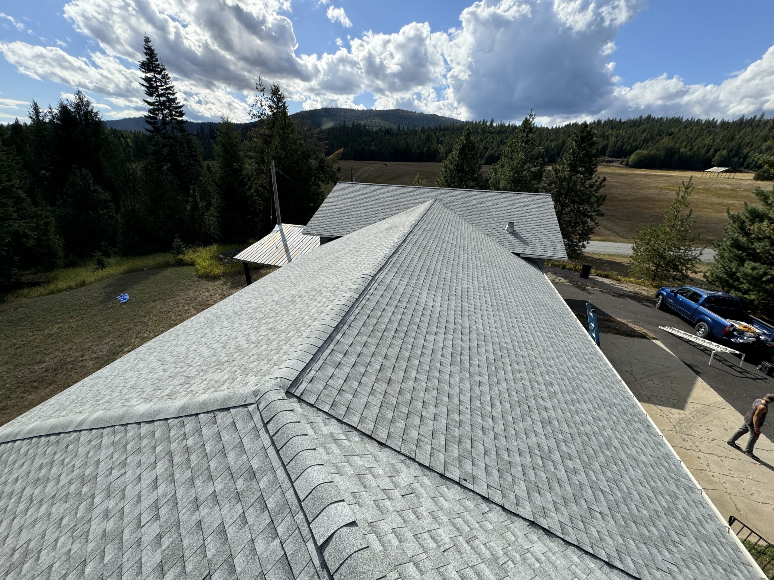 Grey shingle roofing with multiple pitches and valleys in sandpoint idaho.